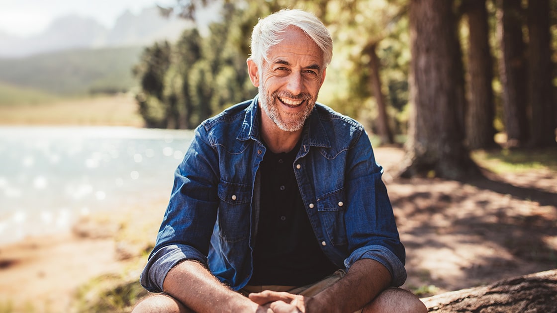 Periodontal Surgery - Man Sitting by Lake